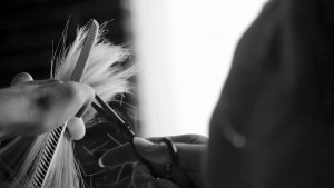 Loree Wesley cutting model Gretchen's hair.